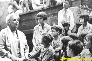 Jane Addams with some children at Hull House