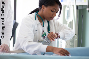 A nurse checking a patient's pulse