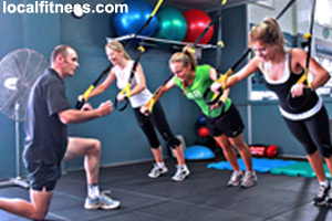 A fitness trainer works with small groups