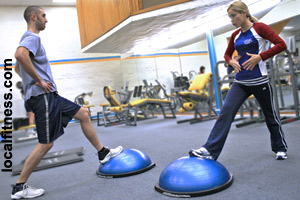 A fitness trainer works with one person.