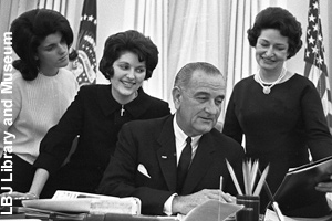 President and Lady Bird Johnson <br>with their two daughters in the Oval Office