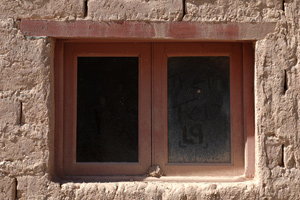 Windows in a modern adobe house