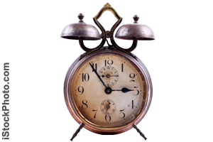 The front of an old alarm clock